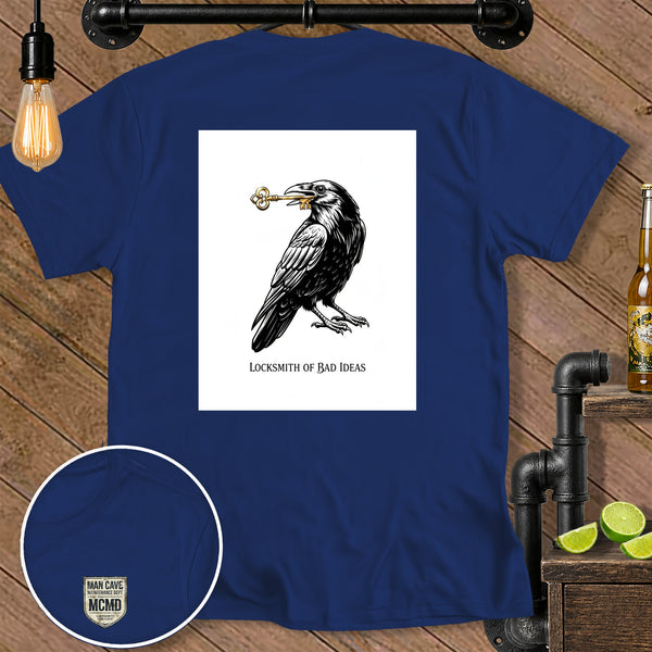 Navy t-shirt with crow holding a key and text "Locksmith of Bad Ideas"