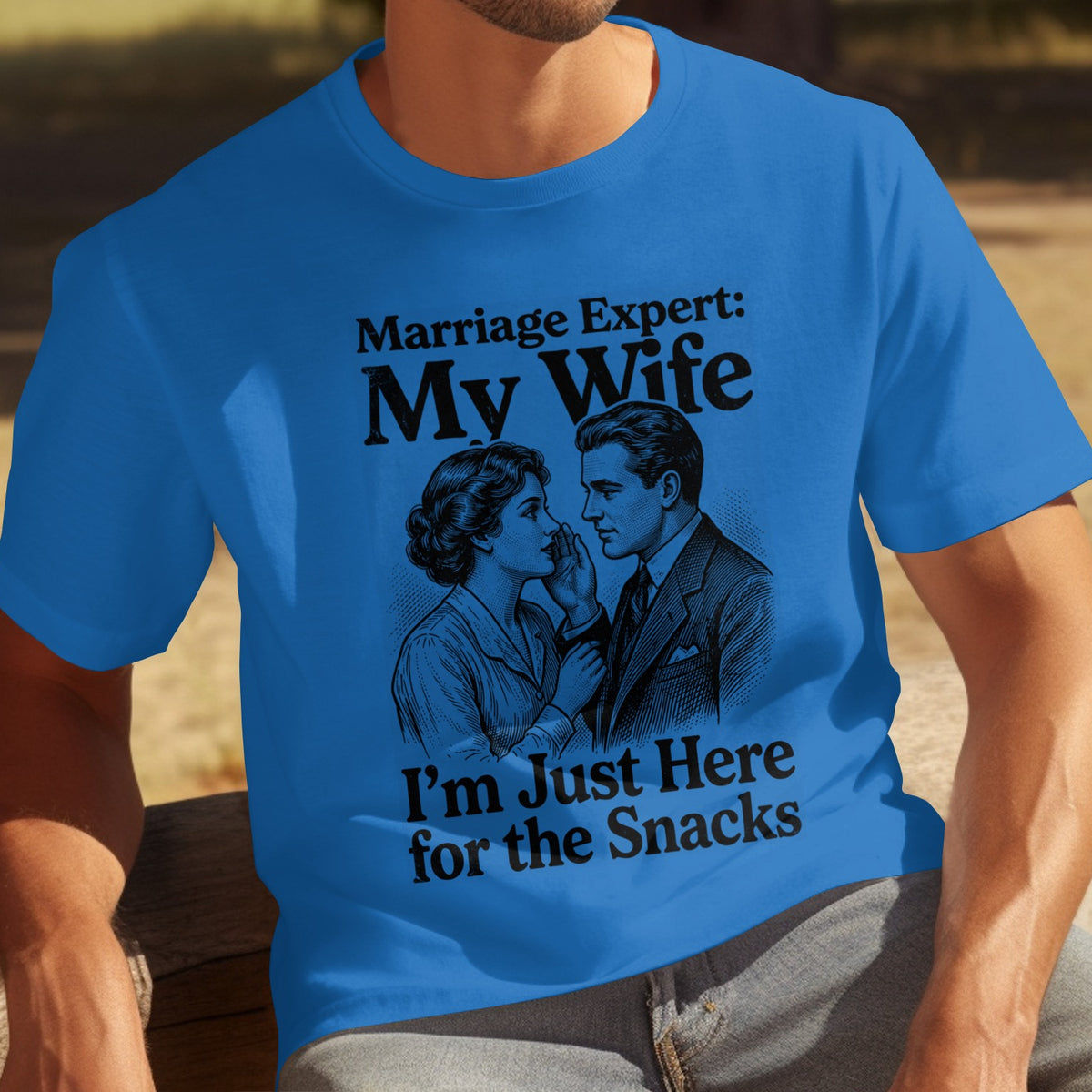 Blue t-shirt with vintage couple illustration and text "Marriage Expert: My Wife I'm Just Here for the Snacks".