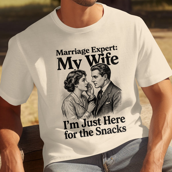 White t-shirt with drawing of a couple and text "Marriage Expert: My Wife I'm Just Here for the Snacks".