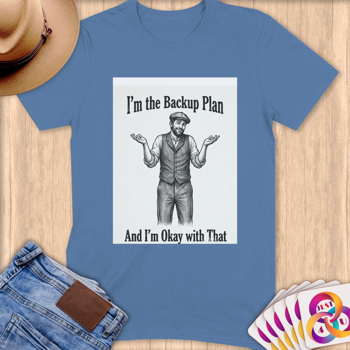 T-shirt with drawing of a man shrugging, text "I'm the Backup Plan".