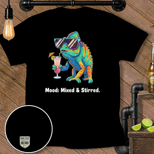 Chameleon wearing sunglasses drinks a pink cocktail with text "Mood: Mixed & Stirred."