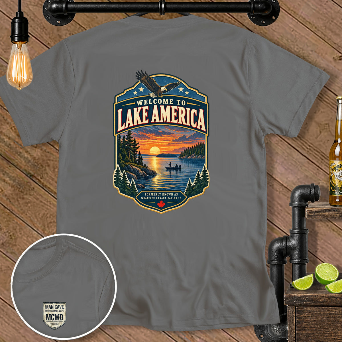 Gray t-shirt with "Welcome to Lake America" graphic and small "Man Cave Maintenance Dept" chest logo.