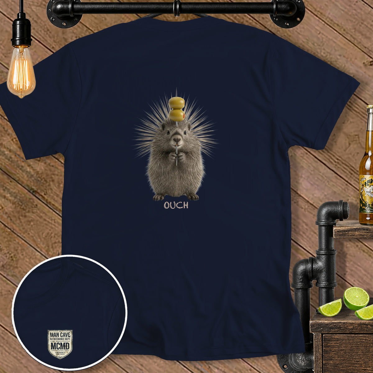 Navy t-shirt with porcupine holding a needle with olives, text "OUCH".