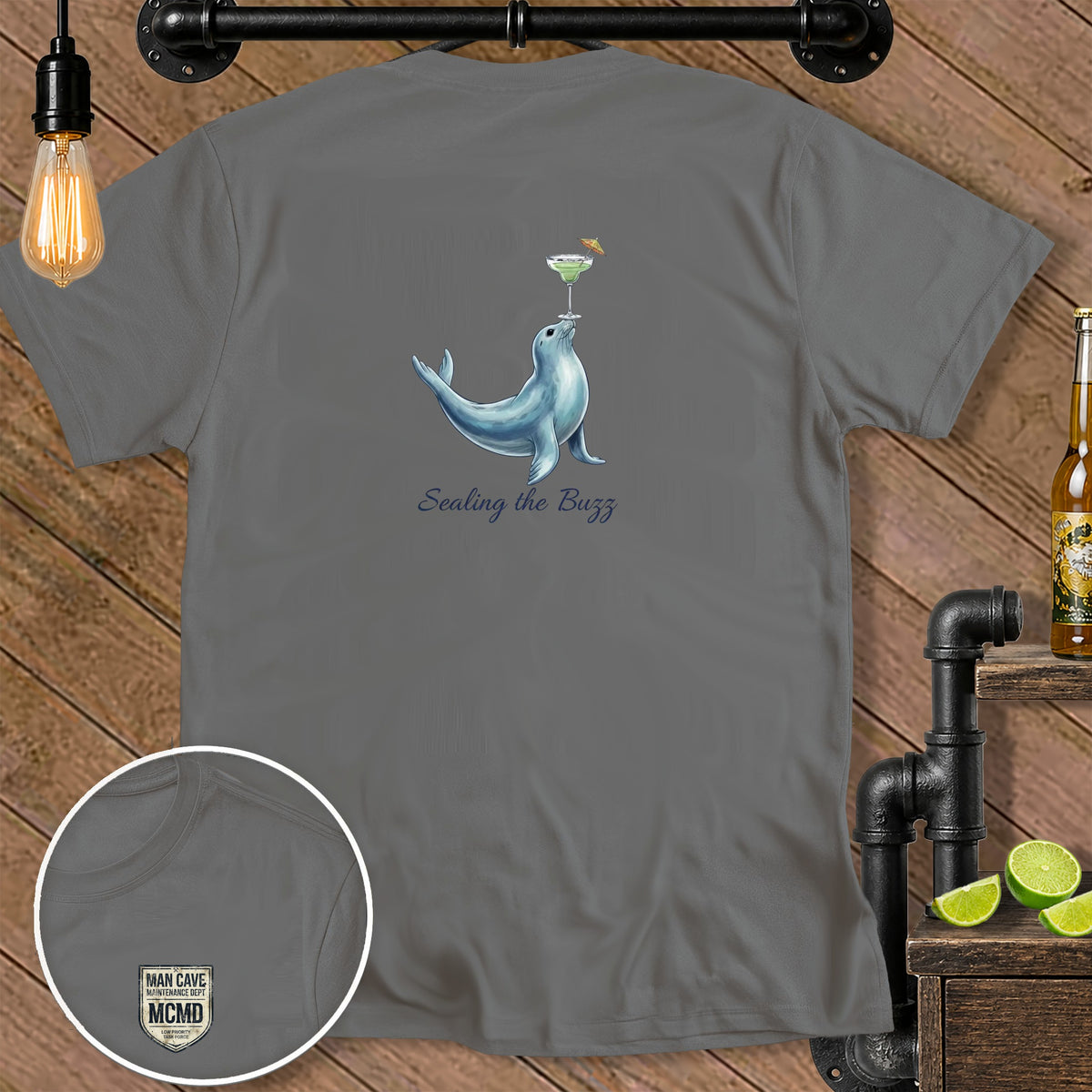Grey t-shirt with seal balancing margarita and text "Sealing the Buzz."