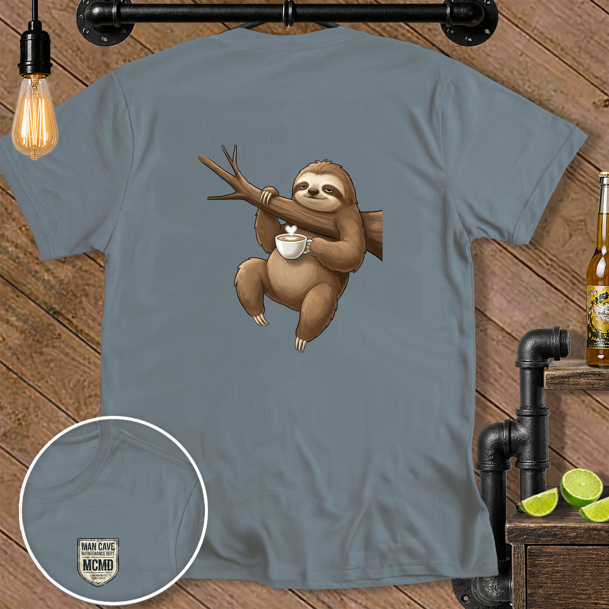 T-shirt with a graphic of a sloth holding coffee and a "Man Cave Maintenance Dept." logo.