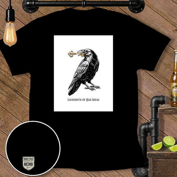 Black t-shirt with a crow holding a key, text "LOCKSMITH OF BAD IDEAS".
