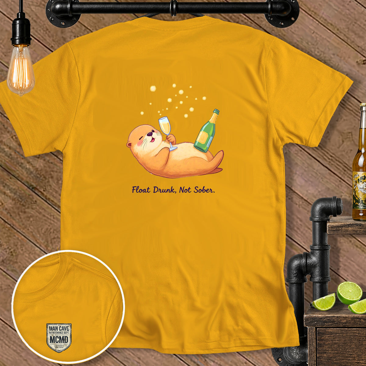 Yellow t-shirt with cartoon otter holding champagne and text "Float Drunk, Not Sober."