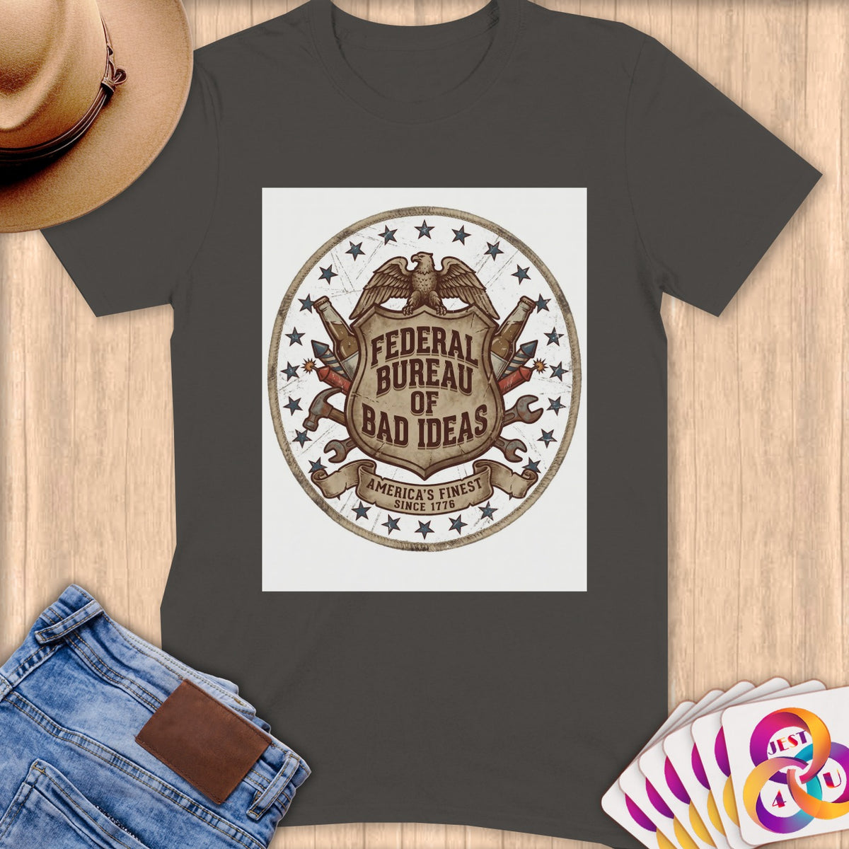Dark gray t-shirt with "Federal Bureau of Bad Ideas" crest graphic.