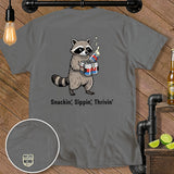 Gray t-shirt with cartoon raccoon holding cans and text 