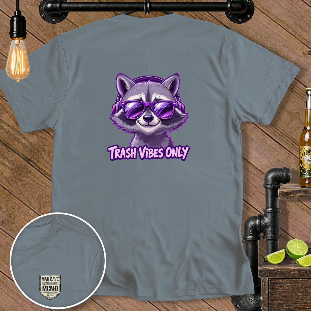 Gray t-shirt with a raccoon wearing headphones and sunglasses, text "Trash Vibes Only".