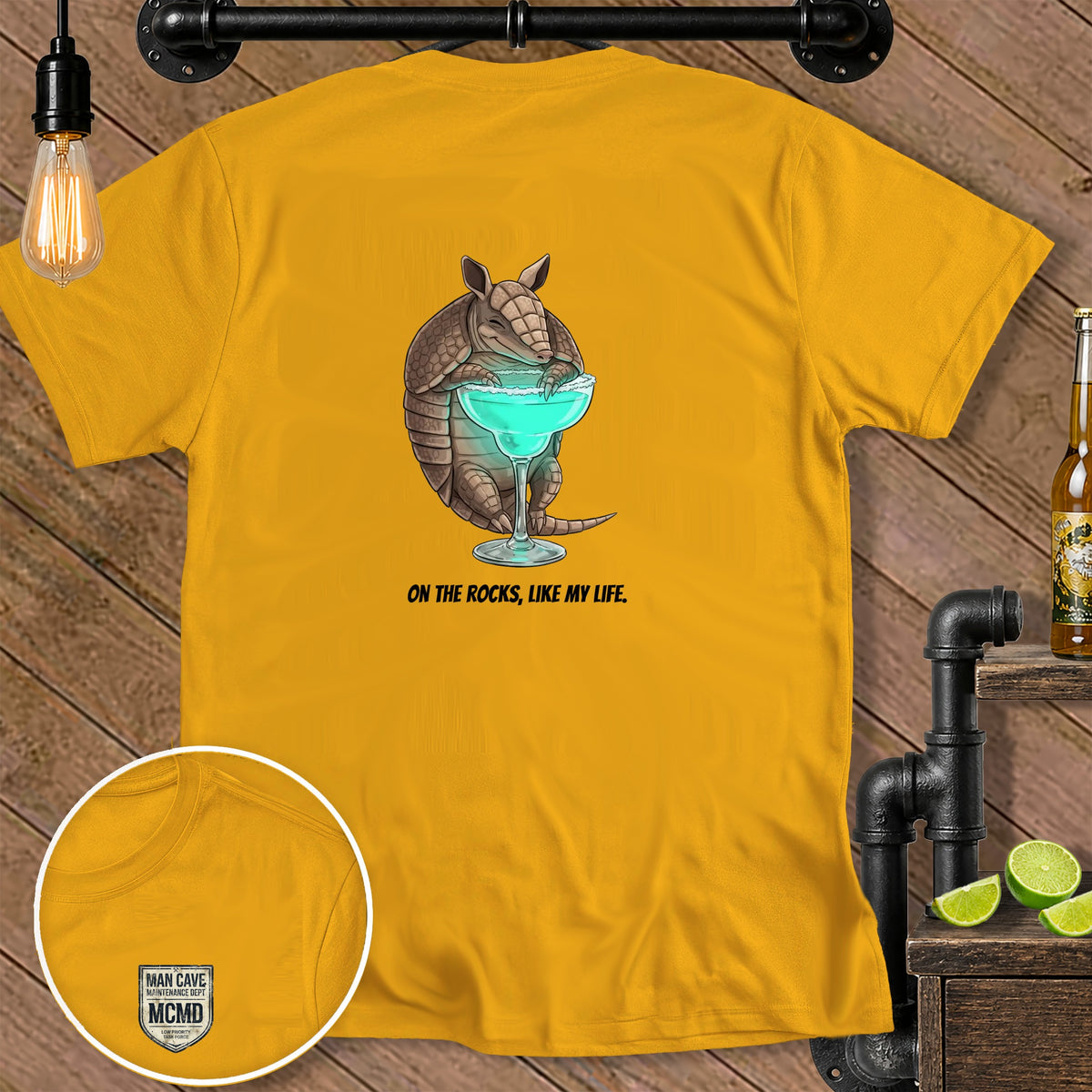 Yellow t-shirt with armadillo drinking a margarita and the text "ON THE ROCKS, LIKE MY LIFE."