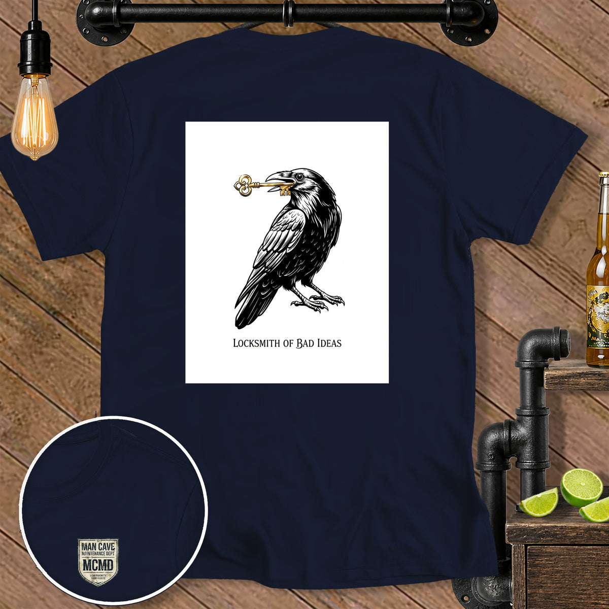 Dark t-shirt with a raven holding a key and text "Locksmith of Bad Ideas."
