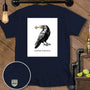 Dark t-shirt with a raven holding a key and text "Locksmith of Bad Ideas."