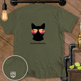 Black cat wearing sunglasses with a sunset scene, text 