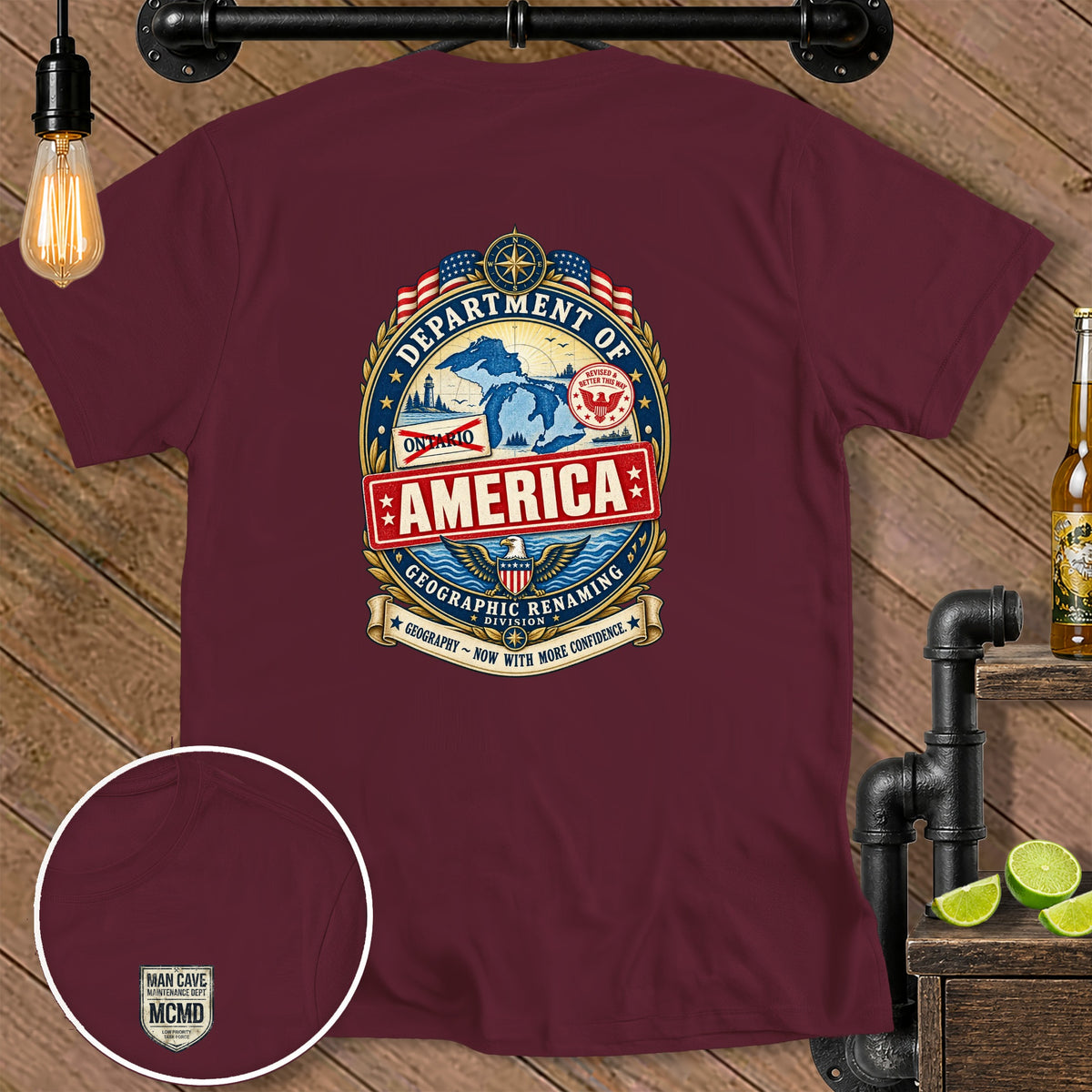 Maroon t-shirt with "Department of America Geographic Renaming Division" emblem and "Man Cave Maintenance Dept." detail.