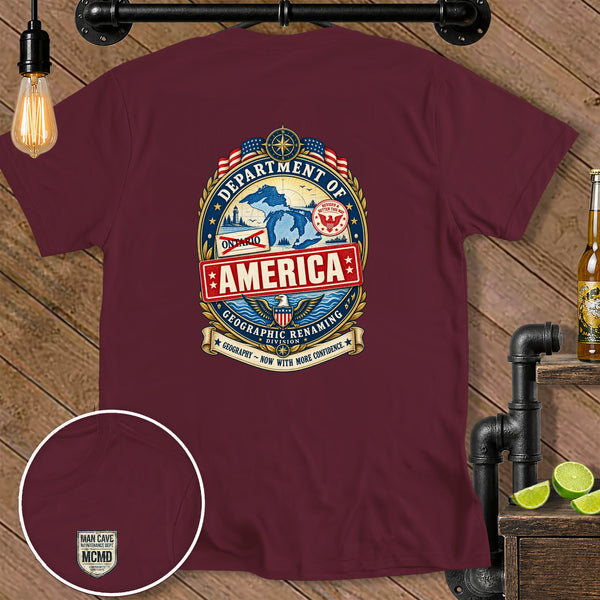 Maroon t-shirt with "Department of America Geographic Renaming Division" emblem and "Man Cave Maintenance Dept." detail.