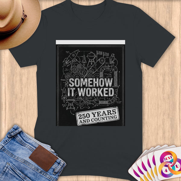 Dark t-shirt featuring graphic "SOMEHOW IT WORKED 250 YEARS AND COUNTING".