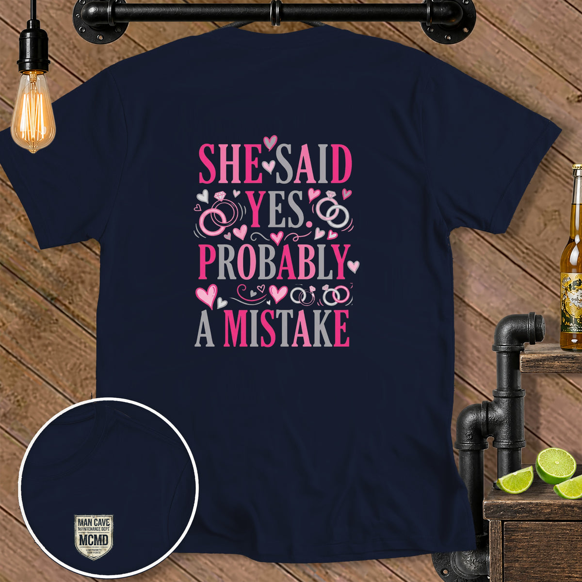 Navy t-shirt with "SHE SAID YES PROBABLY A MISTAKE" graphic.