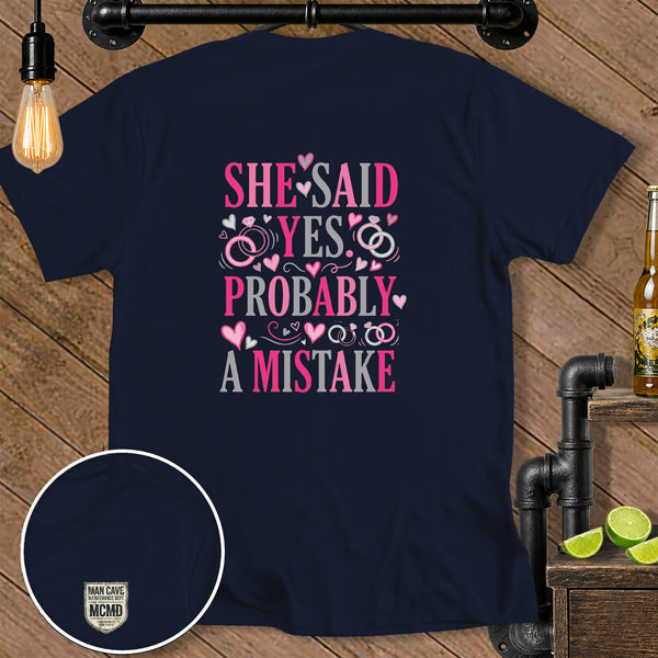 Navy t-shirt with "SHE SAID YES PROBABLY A MISTAKE" graphic.