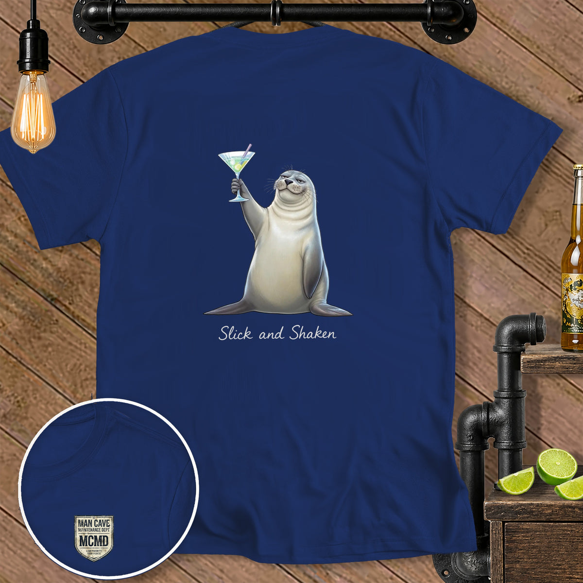 Navy blue t-shirt with a seal holding a martini and text "Slick and Shaken."