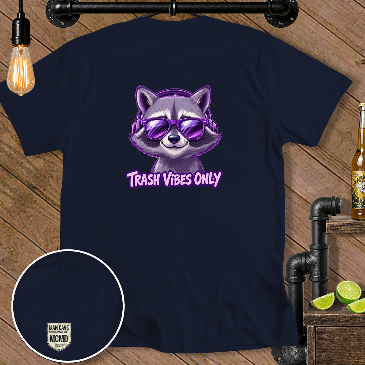 Navy t-shirt with purple raccoon wearing headphones and sunglasses, text "Trash Vibes Only".