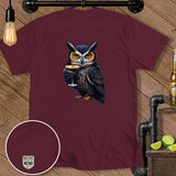 T-shirt with an owl holding a cocktail and a circular embroidered patch.
