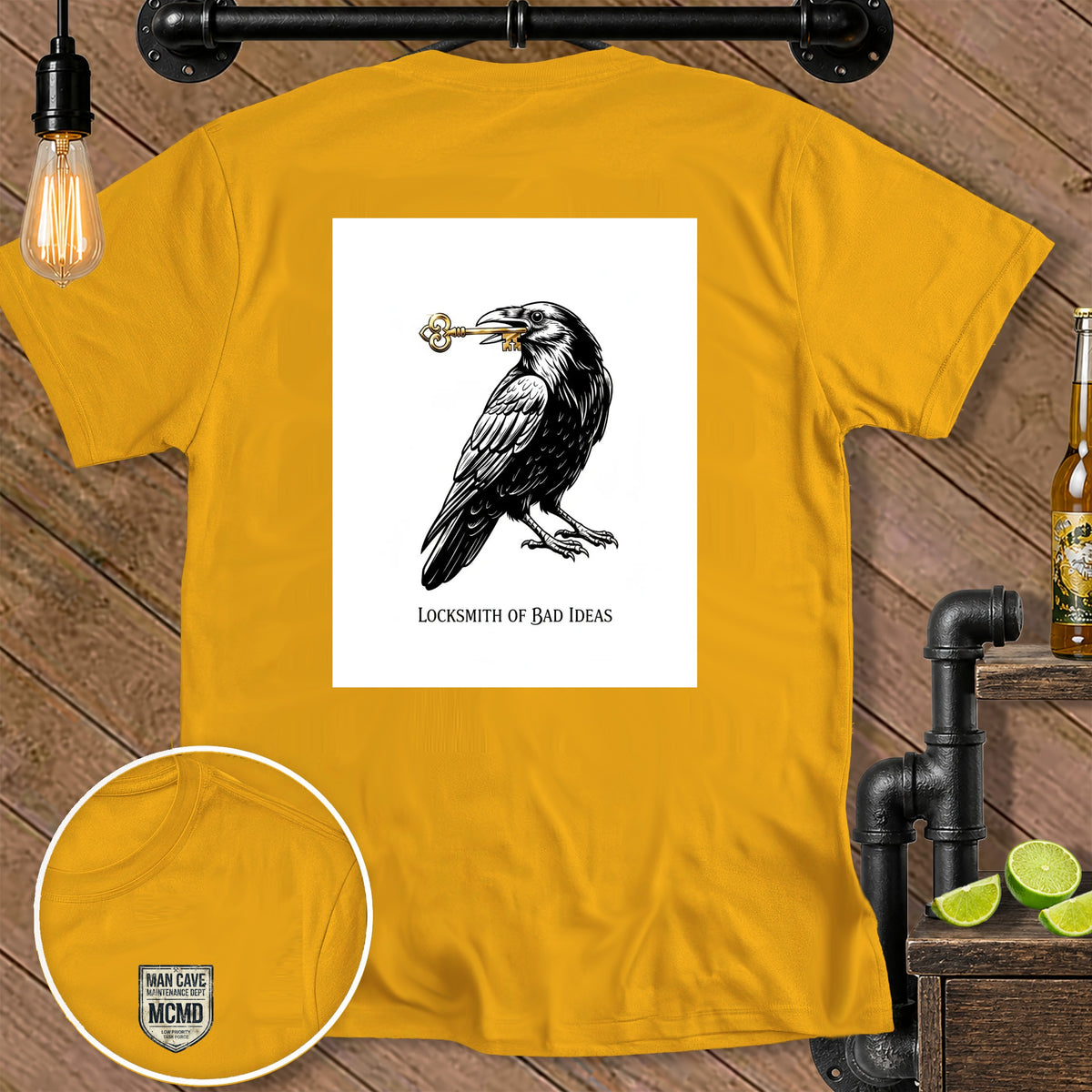 Yellow t-shirt with raven holding a key and "LOCKSMITH OF BAD IDEAS" text.