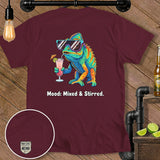 Maroon t-shirt with a colorful chameleon drinking a cocktail, text reads 