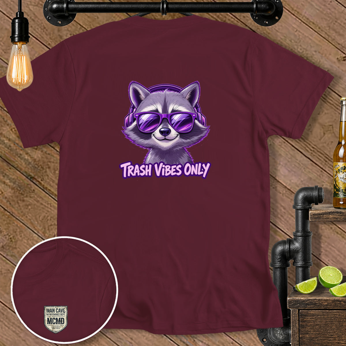 Maroon t-shirt with raccoon wearing headphones and sunglasses, "TRASH VIBES ONLY" text.