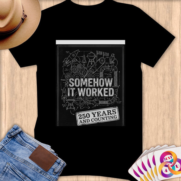 Black t-shirt with "SOMEHOW IT WORKED 250 YEARS AND COUNTING" text and blueprint-style illustrations.