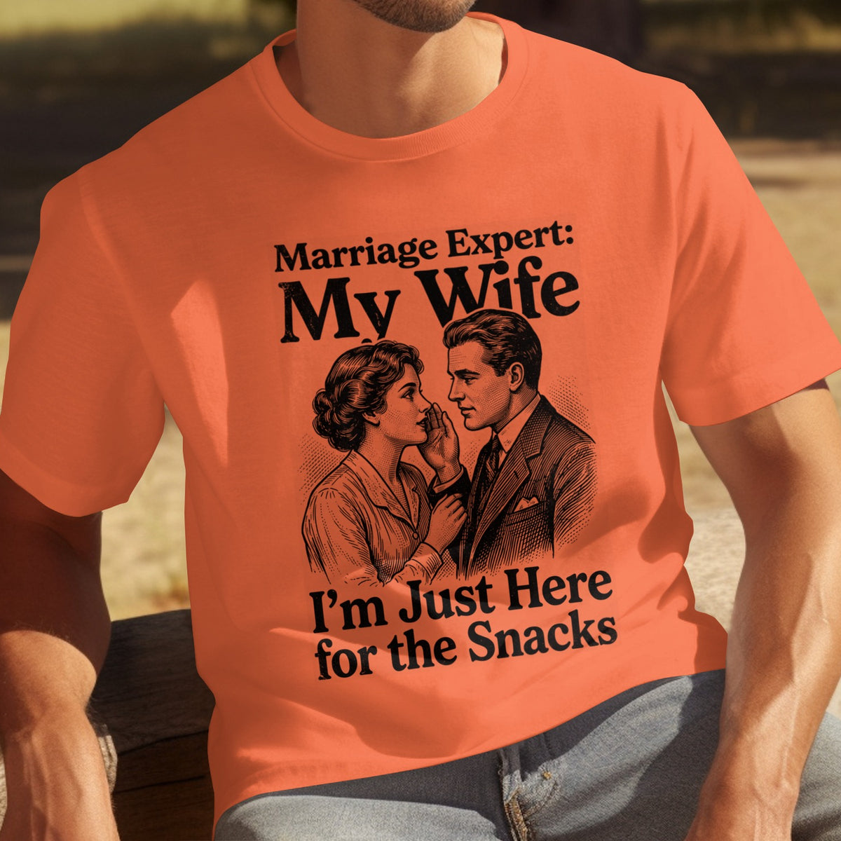 Orange t-shirt with vintage couple illustration and humorous text.