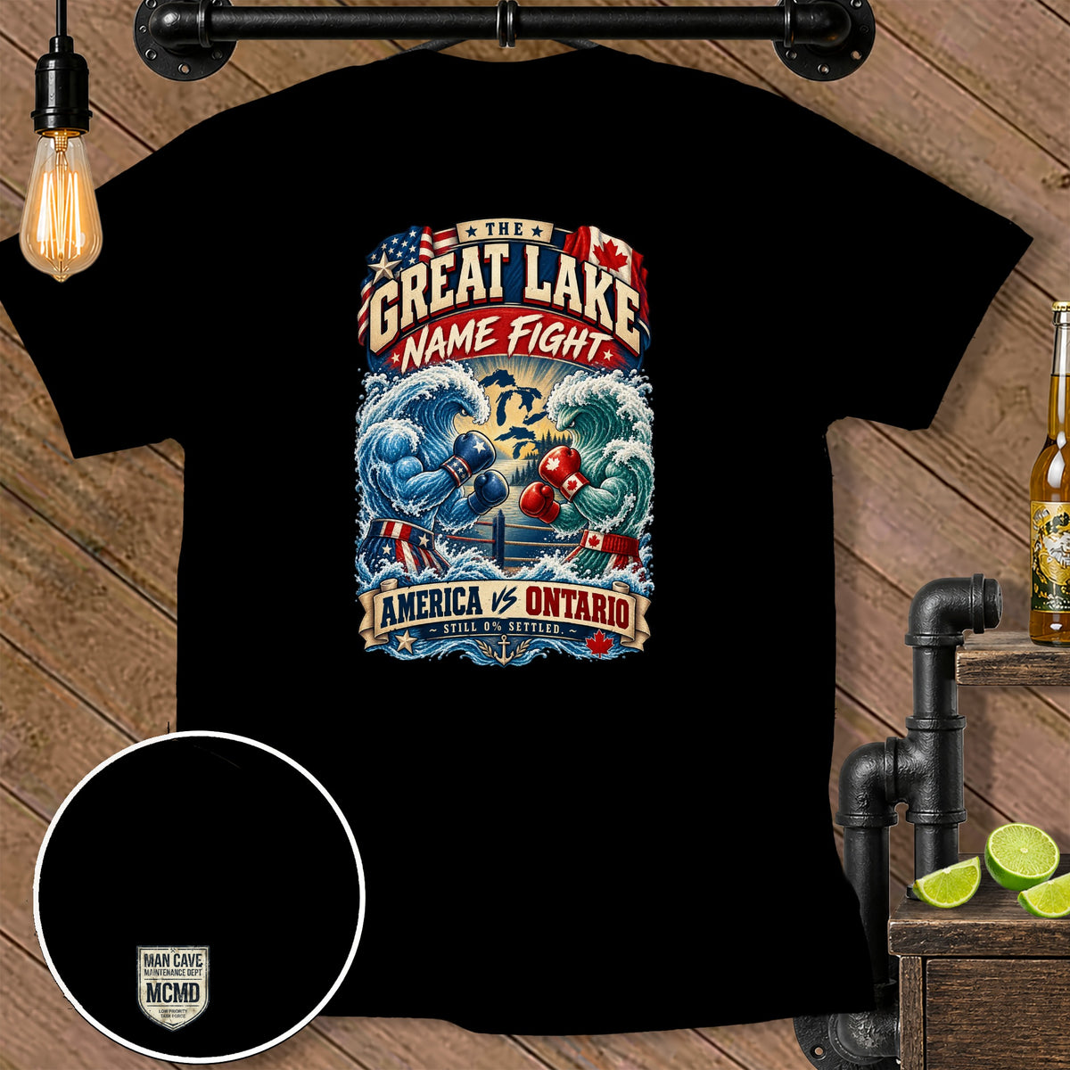 Black t-shirt graphic with "The Great Lake Name Fight" text and boxing waves.