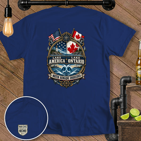 Blue t-shirt with "Lake America Ontario" crest featuring US and Canadian flags, anchors, and compass.
