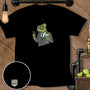 Chameleon in suit holding phone and drink, with "MAN CAVE MCMD" logo.
