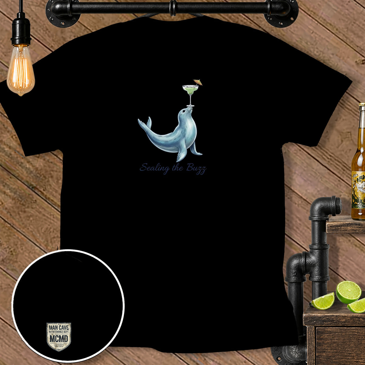 Black t-shirt with a seal balancing a margarita and the text "Sealing the Buzz".