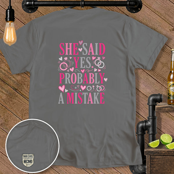 Gray t-shirt with pink and gray text "SHE SAID YES PROBABLY A MISTAKE."