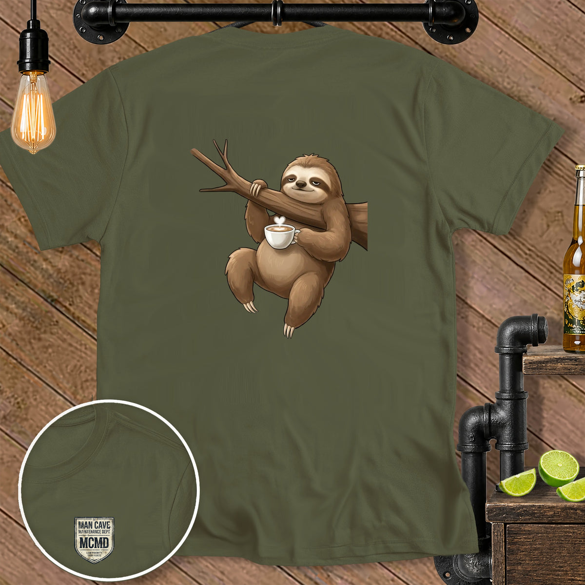 Green t-shirt with sloth holding coffee cup on a branch and embroidered logo.