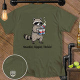 Olive green t-shirt with a raccoon holding cans and the text 