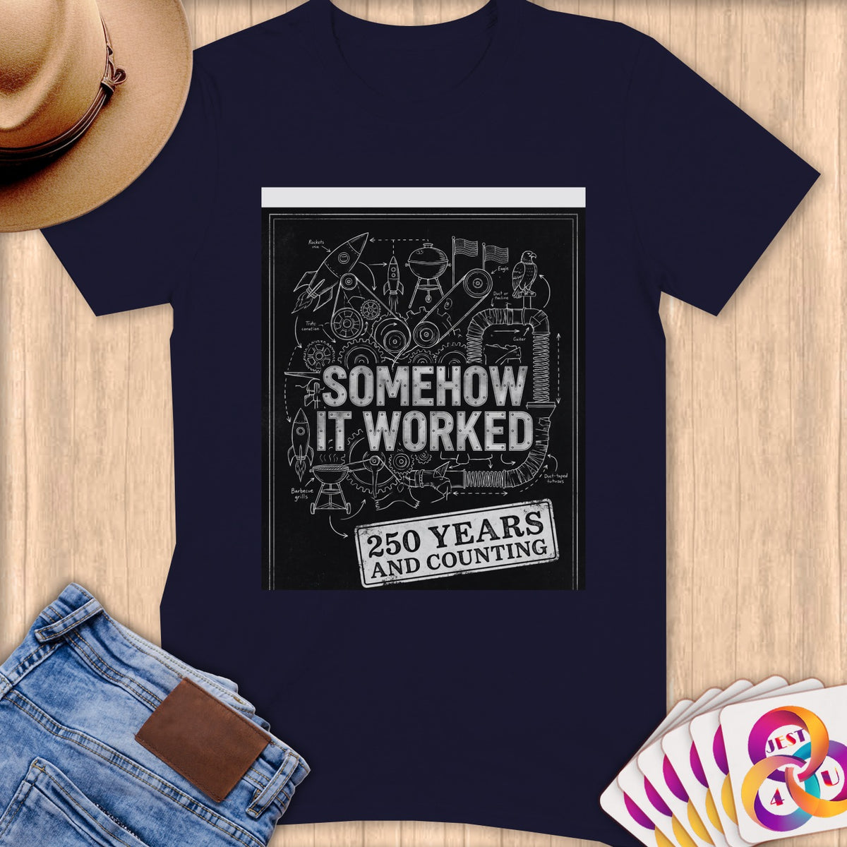 T-shirt graphic: "Somehow It Worked 250 Years and Counting" schematic.