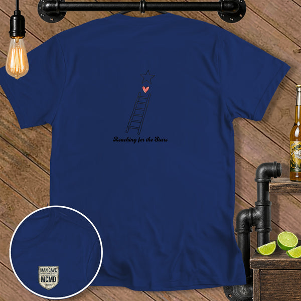 Navy t-shirt with a ladder, heart, star, and text "Reaching for the Stars."