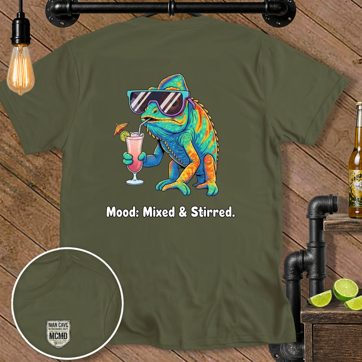 Olive green t-shirt with a colorful chameleon drinking a cocktail and text "Mood: Mixed & Stirred."