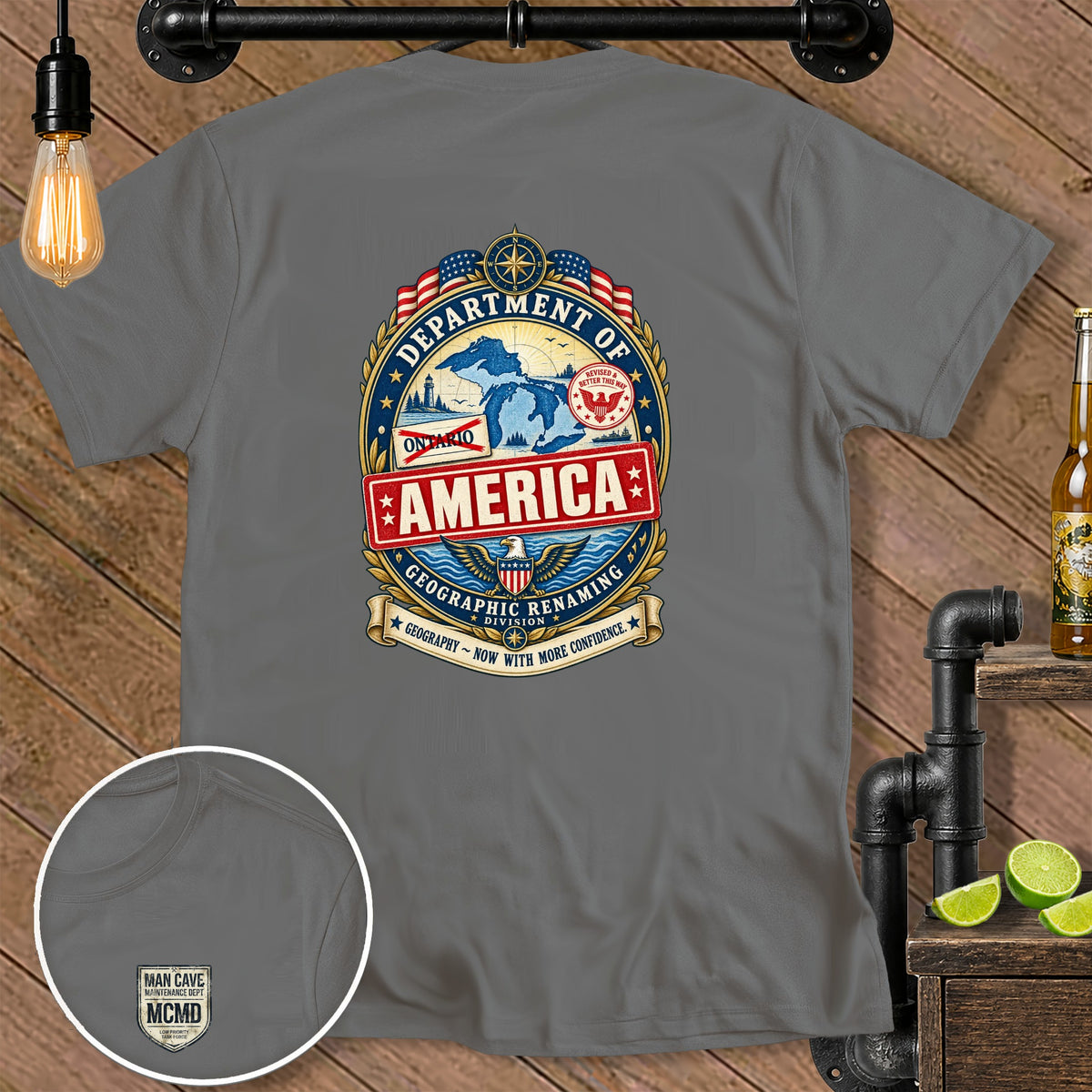 Grey t-shirt with "Department of America" graphic and "Man Cave Maintenance Dept MCMD" on chest pocket.