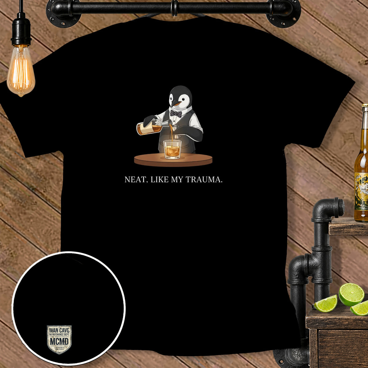 Black t-shirt featuring a penguin pouring whiskey and the text "NEAT. LIKE MY TRAUMA."