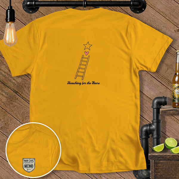 Yellow t-shirt with a ladder reaching for a star, and "Reaching for the Stars" text.