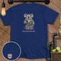 Blue t-shirt with a cartoon koala wearing a robe and holding wine, text "POUR CHOICES WERE MADE".