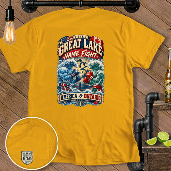 Yellow t-shirt with "Great Lake Name Fight America vs Ontario" graphic and small chest logo.