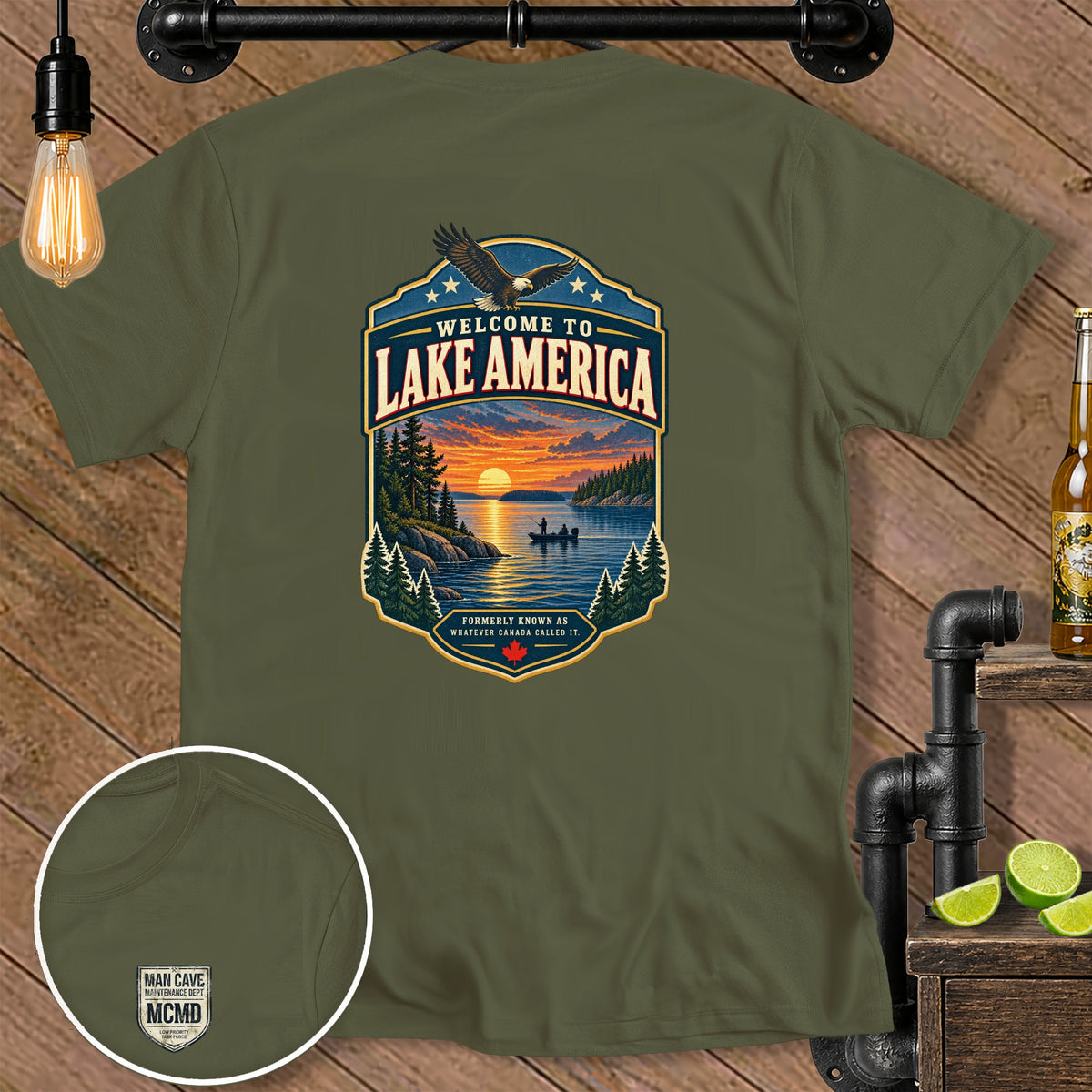 Olive green t-shirt with "Welcome to Lake America" graphic and "Man Cave MCMD" logo.