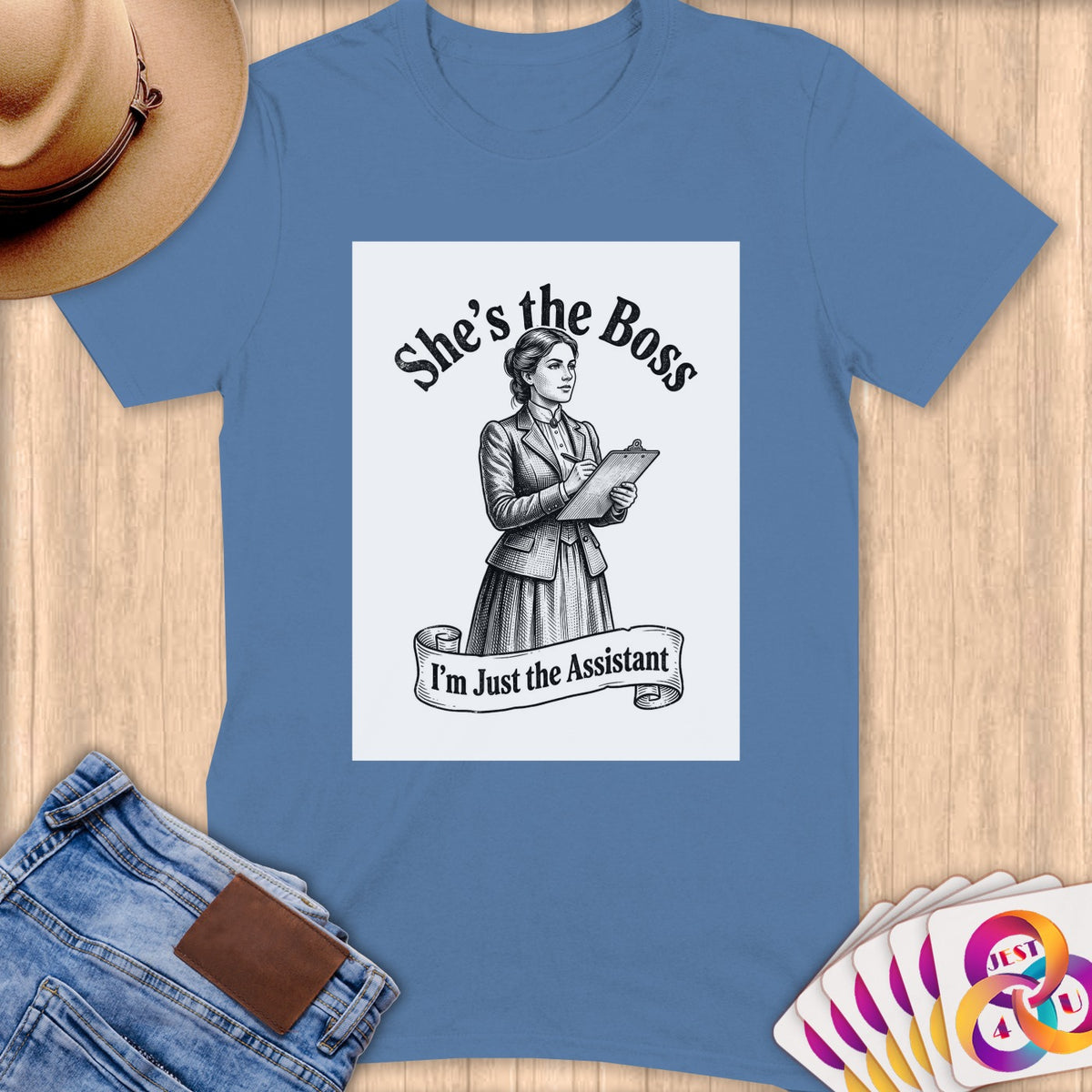 T-shirt with "She's the Boss, I'm Just the Assistant" graphic featuring a sketched woman.