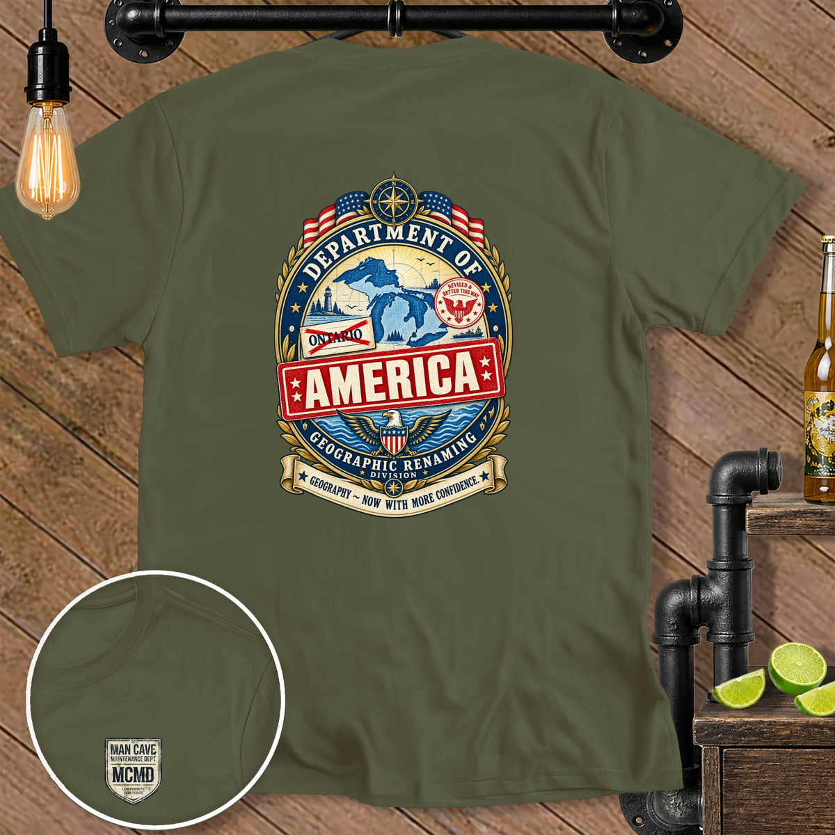 Olive green t-shirt with "Department of America Geographic Renaming Division" emblem.