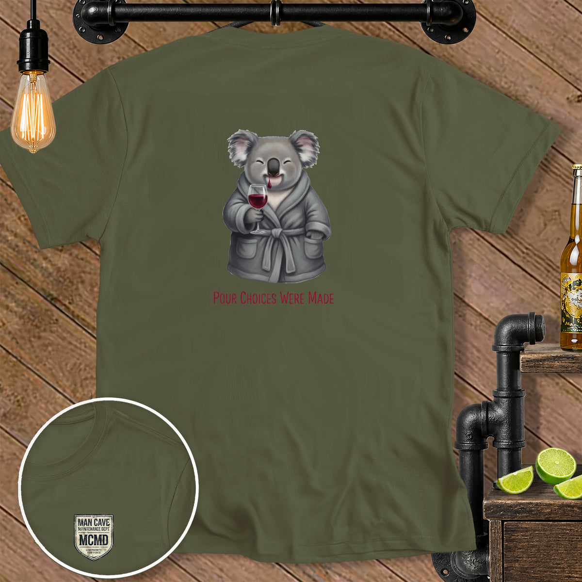 Olive green t-shirt with a graphic of a koala holding wine, text reads "POUR CHOICES WERE MADE".